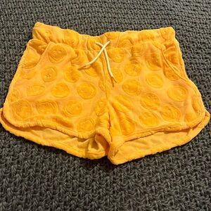 Orange smiley face shorts in size L (10/12)
